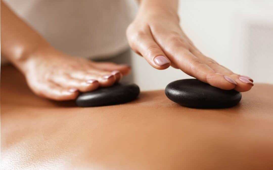 Hot stone massage therapy session at North London massage clinic